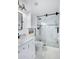 Modern bathroom with white subway tile, glass shower, and marble countertops at 7501 N 22Nd Pl, Phoenix, AZ 85020