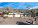 Single story home with a large driveway and mountain views at 7501 N 22Nd Pl, Phoenix, AZ 85020