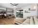 Living room with fireplace, hardwood floors, sliding glass doors to backyard, and a neutral color palette at 7501 N 22Nd Pl, Phoenix, AZ 85020