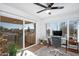 Home office with desk, chair, and sliding glass doors to a patio at 7501 N 22Nd Pl, Phoenix, AZ 85020