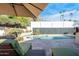 Relaxing patio with lounge chairs, offering pool views at 7501 N 22Nd Pl, Phoenix, AZ 85020