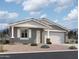 Single-story home with gray siding, white trim, and a two-car garage at 7689 W Smoketree Dr, Peoria, AZ 85383