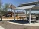 Community playground with shaded seating and play equipment at 7689 W Smoketree Dr, Peoria, AZ 85383