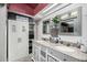 Double vanity bathroom with granite countertops at 7945 W Wethersfield Rd, Peoria, AZ 85381