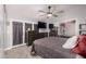 Main bedroom with a large bed and mirrored closet doors at 7945 W Wethersfield Rd, Peoria, AZ 85381