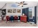 Small dining area with a red cabinet and three red and blue chairs at 7945 W Wethersfield Rd, Peoria, AZ 85381