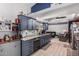 Modern kitchen with granite counters and gray cabinets at 7945 W Wethersfield Rd, Peoria, AZ 85381