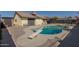 Large kidney shaped pool with diving board at 7945 W Wethersfield Rd, Peoria, AZ 85381