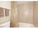 Clean bathroom with shower/tub combo and neutral tile at 7950 E Camelback Rd # 512, Scottsdale, AZ 85251