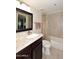 Bathroom with granite countertop and dark wood vanity at 7950 E Camelback Rd # 512, Scottsdale, AZ 85251