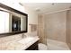 Bathroom with granite countertop and dark wood vanity at 7950 E Camelback Rd # 512, Scottsdale, AZ 85251