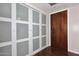 Bright condo entryway with large closet and dark wood flooring at 7950 E Camelback Rd # 512, Scottsdale, AZ 85251