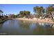 Serene pond view with reflection of building and trees at 7950 E Camelback Rd # 512, Scottsdale, AZ 85251