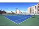 Well-maintained tennis courts with green and blue surface at 7950 E Camelback Rd # 512, Scottsdale, AZ 85251