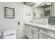 Bright bathroom with white cabinets and a large vanity at 8008 E Del Rubi Dr, Scottsdale, AZ 85258