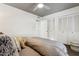 Serene bedroom with gray bedding and ample closet space at 8008 E Del Rubi Dr, Scottsdale, AZ 85258