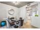 Bright dining area with a round glass table and four upholstered chairs at 8008 E Del Rubi Dr, Scottsdale, AZ 85258