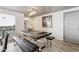 Elegant dining area with dark wood table, metal chairs, and wood-look floors at 8008 E Del Rubi Dr, Scottsdale, AZ 85258