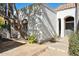 Front entrance with arched entryway and flagstone path at 8008 E Del Rubi Dr, Scottsdale, AZ 85258