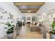 Living room with hardwood floors, a fireplace, and abundant natural light at 8008 E Del Rubi Dr, Scottsdale, AZ 85258