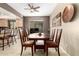 Dining area with a wooden table and chairs, adjacent to the kitchen at 900 S 94Th St # 1001, Chandler, AZ 85224