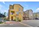 Front view of a yellow townhome with landscaping at 900 S 94Th St # 1066, Chandler, AZ 85224