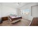 Bright bedroom with carpeted floor, window, and ceiling fan at 9089 W Troy Dr, Arizona City, AZ 85123