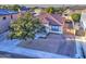 House with tile roof, driveway, and a large tree at 9136 E Plata Ave, Mesa, AZ 85212