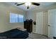 Simple bedroom with a single bed, dresser, and window blinds at 9136 E Plata Ave, Mesa, AZ 85212