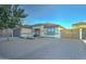 Single-story home with brick driveway and wooden gate at 9136 E Plata Ave, Mesa, AZ 85212