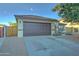 One-story home with brown garage door and small front yard at 9136 E Plata Ave, Mesa, AZ 85212