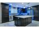 Modern kitchen with dark cabinets, quartz countertops, and LED under-cabinet lighting at 9136 E Plata Ave, Mesa, AZ 85212