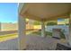 Relaxing backyard patio with built-in grill and artificial turf at 9136 E Plata Ave, Mesa, AZ 85212