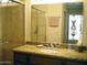 Bathroom with granite countertop, walk-in shower, and stained glass at 9707 E Mountain View Rd # 1430, Scottsdale, AZ 85258