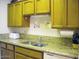 Kitchen with granite countertops and wood cabinets at 9707 E Mountain View Rd # 1430, Scottsdale, AZ 85258