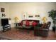 Comfortable living room featuring a leather sofa and warm decor at 9707 E Mountain View Rd # 1430, Scottsdale, AZ 85258