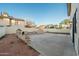 Backyard with patio, fire pit, and block retaining walls at 9920 W Calle Encorvada --, Phoenix, AZ 85037