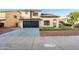 Two-story house with a black garage door and artificial turf at 9920 W Calle Encorvada --, Phoenix, AZ 85037