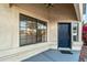 Front entrance with a navy blue door and a large window at 9920 W Calle Encorvada --, Phoenix, AZ 85037