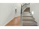 Modern staircase with a metal railing and carpeted steps at 9920 W Calle Encorvada --, Phoenix, AZ 85037