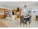 Modern kitchen with island and dining area at 1129 E La Mirada Dr, Phoenix, AZ 85042