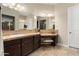 Elegant bathroom with custom vanity, vanity table, and tile countertops with dual sinks, and plenty of storage at 12935 W Lone Tree Trl, Peoria, AZ 85383