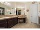 Bathroom boasts a large vanity, walk-in shower and separate tub at 12935 W Lone Tree Trl, Peoria, AZ 85383