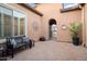 Relaxing courtyard with a bench and access to the house at 12935 W Lone Tree Trl, Peoria, AZ 85383