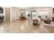 Open concept living space combines dining and living areas with tile flooring and access to the backyard at 12935 W Lone Tree Trl, Peoria, AZ 85383