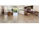 Spacious living room includes tile flooring, recessed lighting, and sliding glass doors to the backyard at 12935 W Lone Tree Trl, Peoria, AZ 85383
