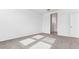 Bright bedroom with carpet flooring and access to bathroom at 1531 E Lardner Dr, Casa Grande, AZ 85122