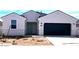 Charming single-story home with a large garage and desert landscaping in the front yard at 1531 E Lardner Dr, Casa Grande, AZ 85122