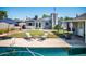 Home with a large backyard, pool, patio furniture, and grassy area at 2157 W Mulberry Dr, Phoenix, AZ 85015