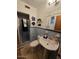 Cozy bathroom featuring blue tile, a pedestal sink, and a glass-enclosed shower at 2157 W Mulberry Dr, Phoenix, AZ 85015